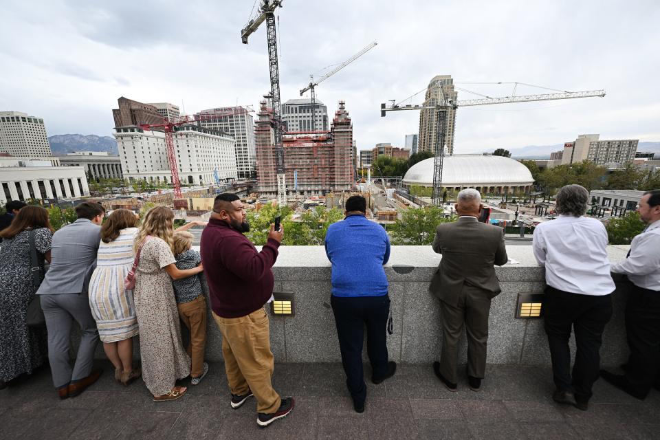 People stand and look out at the Salt Lake Temple after the Saturday afternoon session of the 193rd Semiannual General Conference of The Church of Jesus Christ of Latter-day Saints at the Conference Center in Salt Lake City on Saturday, Sept. 30, 2023. | Scott G Winterton, Deseret News