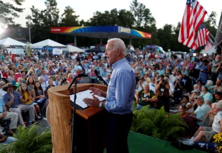 FILE PHOTO: Democratic U.S. presidential candidate and former Vice President Joe Biden waits to be introduced during the 2019 Presidential Galivants Ferry Stump Meeting in Galivants Ferry