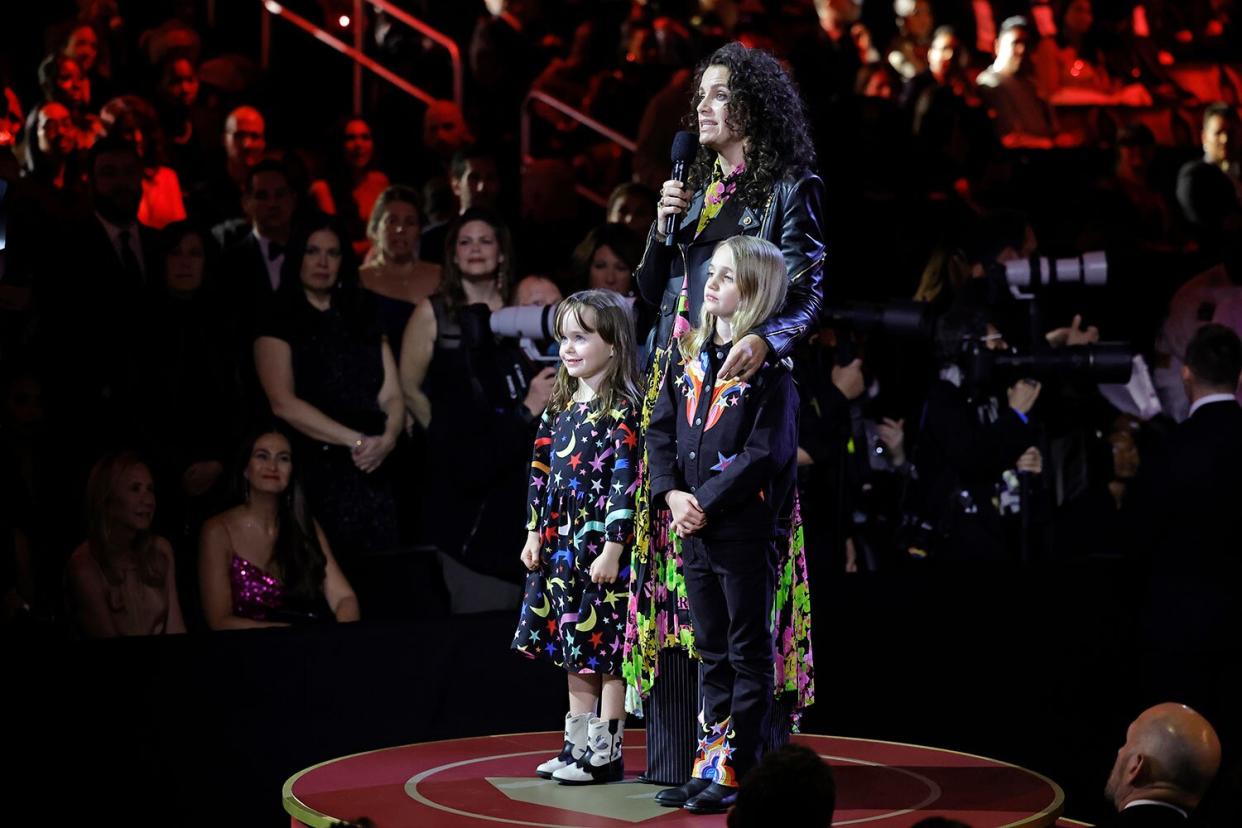 LOS ANGELES, CALIFORNIA - FEBRUARY 05: (L-R) Elijah Carlile, Catherine Shepherd, and Evangeline Ruth Carlile speak during the 65th GRAMMY Awards at Crypto.com Arena on February 05, 2023 in Los Angeles, California. (Photo by Kevin Winter/Getty Images for The Recording Academy )