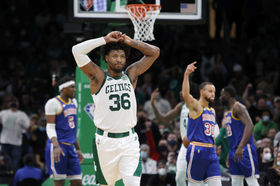 Boston Celtics guard Marcus Smart (36) reacts to a call during the second half of an NBA basketball game against the Golden State Warriors, Friday, Dec. 17, 2021, in Boston. (AP Photo/Mary Schwalm)