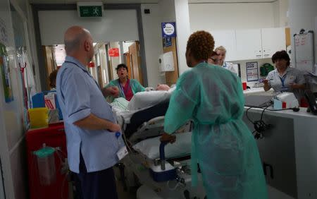 Hospital workers communicate to each other in Ward 8 at Milton Keynes University Hospital in central England, Britain, May 23, 2018. REUTERS/Hannah McKay