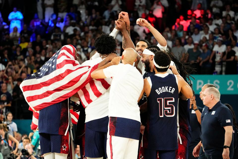 13 iconic photos of the men's USA basketball team celebrating Olympic