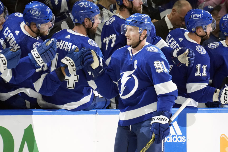 Tampa Bay Lightning center Steven Stamkos (91) celebrates with teammates after his goal against the San Jose Sharks during the first period of an NHL hockey game Thursday, Oct. 26, 2023, in Tampa, Fla. (AP Photo/Chris O'Meara)