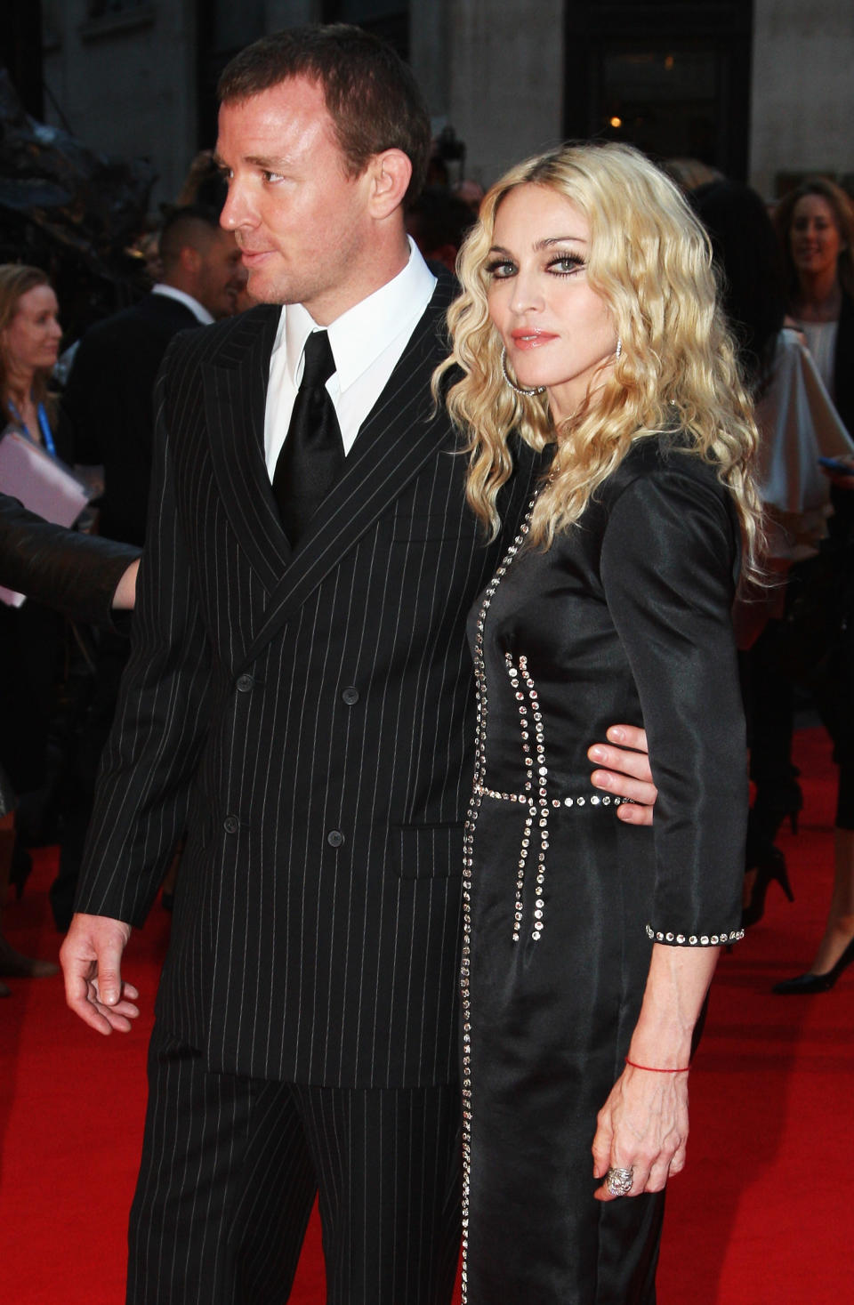 LONDON - SEPTEMBER 01:  Director Guy Ritchie and his wife Madonna arrive at the World Premiere of "RocknRolla" at the Odeon West End cinema, Leicester Square on September 1, 2008 in London, England.  (Photo by Chris Jackson/Getty Images)