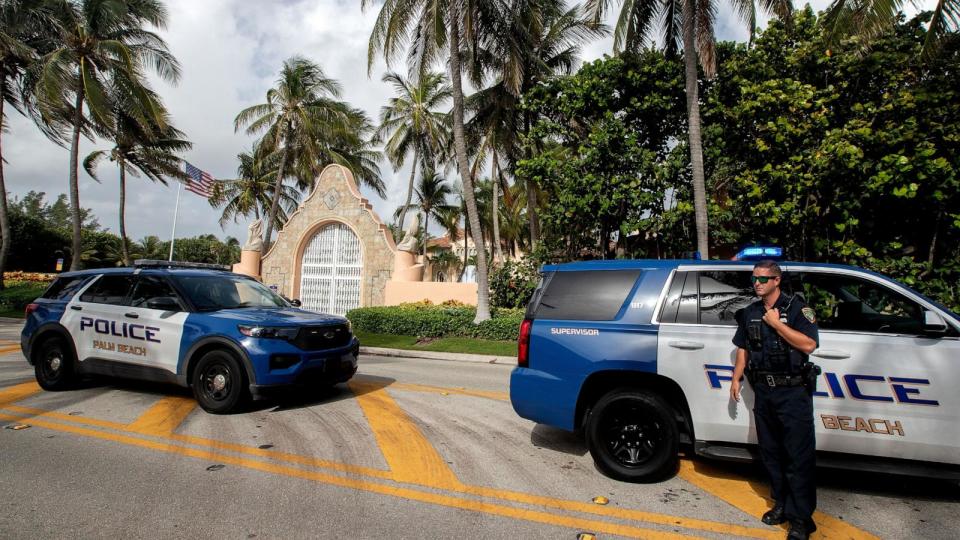 PHOTO: Authorities stand outside Mar-a-Lago, the residence of former President Donald Trump, amid reports of the FBI executing a search warrant as a part of a document investigation, in Palm Beach, Fla., Aug. 9, 2022. (Cristobal Herrera-Ulashkevich/EPA via Shutterstock, FILE)