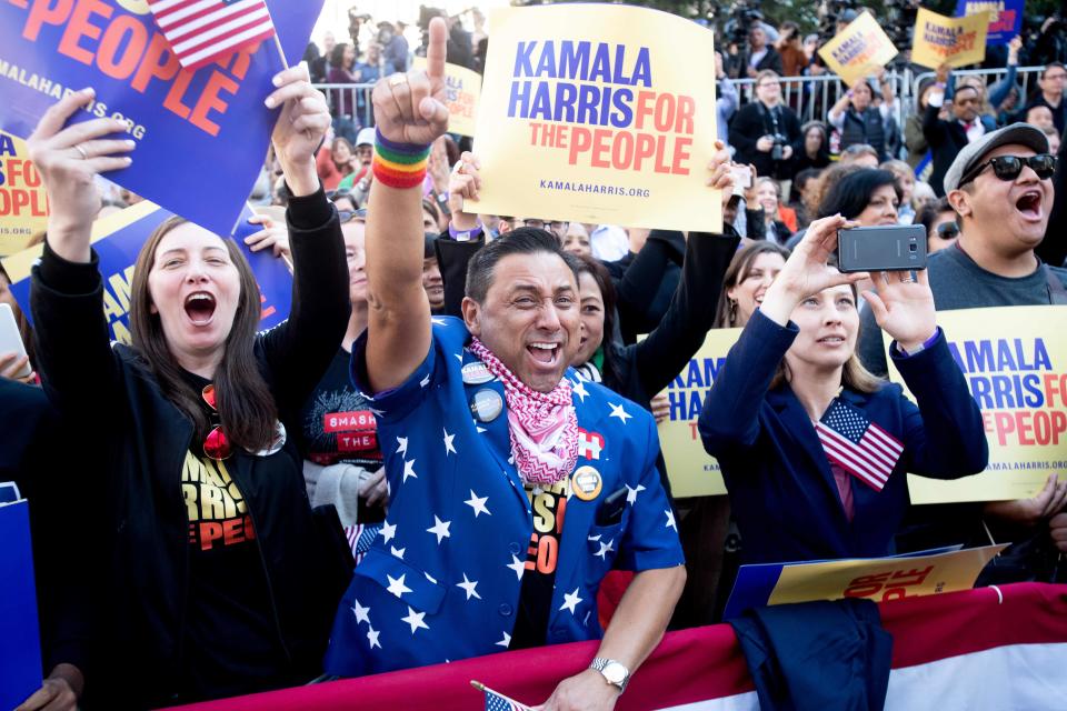 Robert Camacho (C) cheers as California Senator Kamala Harris launches her presidential campaign on January 27, 2019 in Oakland, California. (Photo by NOAH BERGER / AFP)NOAH BERGER/AFP/Getty Images ORG XMIT: Kamala Ha ORIG FILE ID: AFP_1CQ7VB