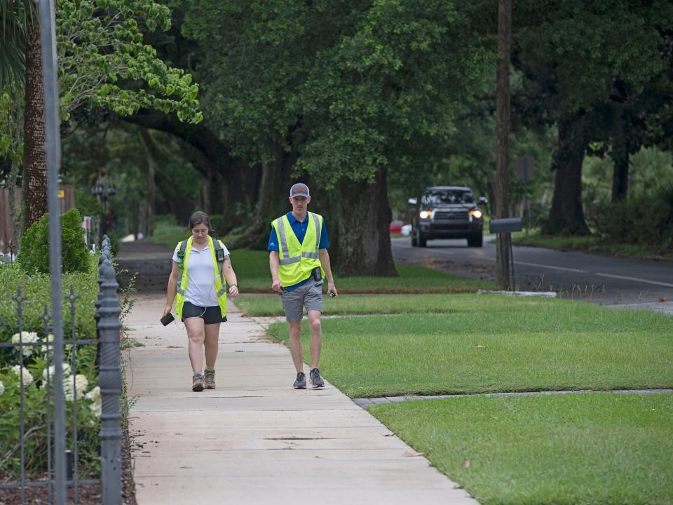 Mel Medley and Robert Dunn of Geosyntec Consultants work to complete a tree survey in the East Hill neighborhood on Thursday. The city of Pensacola hired Geosyntec to take an inventory of the trees on government-owned property throughout the city.