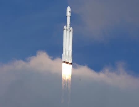 A SpaceX Falcon Heavy rocket climbs towards space after lifting off from historic launch pad 39-A at the Kennedy Space Center in Cape Canaveral, Florida, U.S., February 6, 2018. REUTERS/Joe Skipper