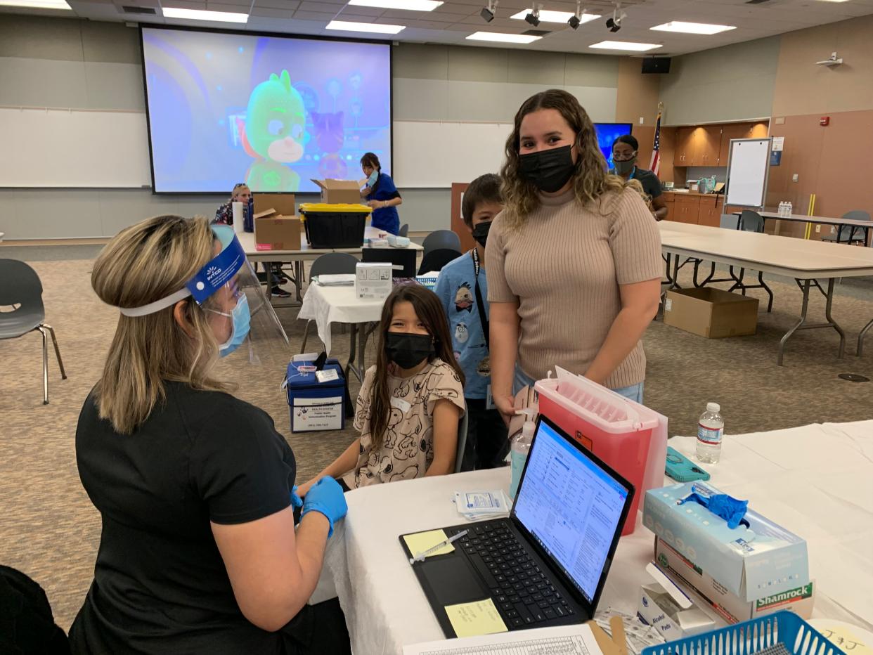 A Desert Sands student receives her vaccination.