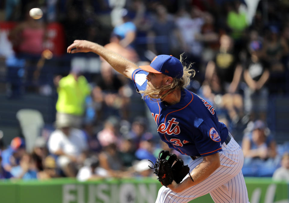 New York Mets starting pitcher Noah Syndergaard throws during the first inning of an exhibition spring training baseball game against the Houston Astros, Saturday, March 2, 2019, in Port St. Lucie, Fla. (AP Photo/Jeff Roberson)