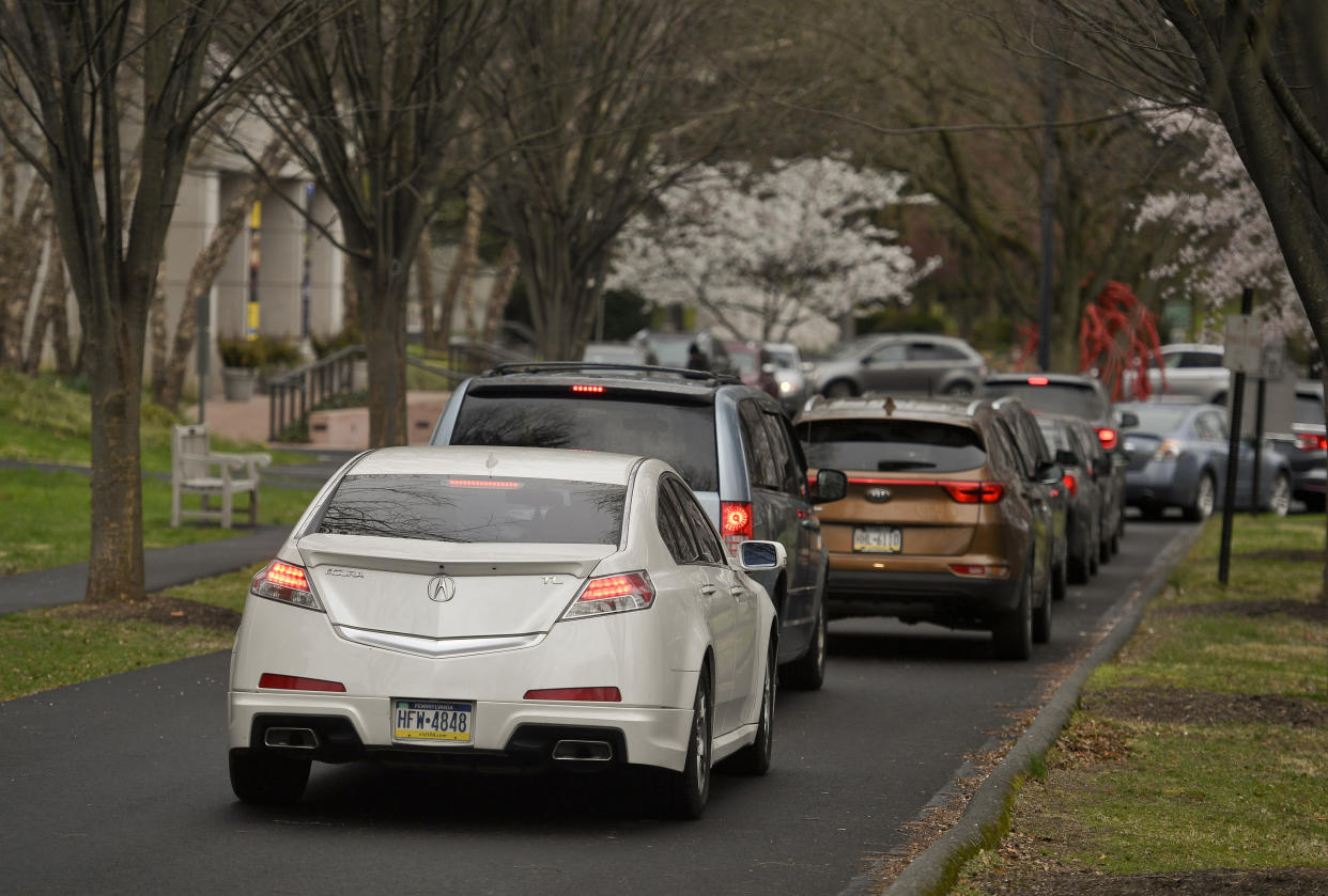 Cars line up before the start of distribution at the Reading Public Museum in Reading, PA Friday morning April 3, 2020. (Photo by Ben Hasty/MediaNews Group/Reading Eagle via Getty Images)