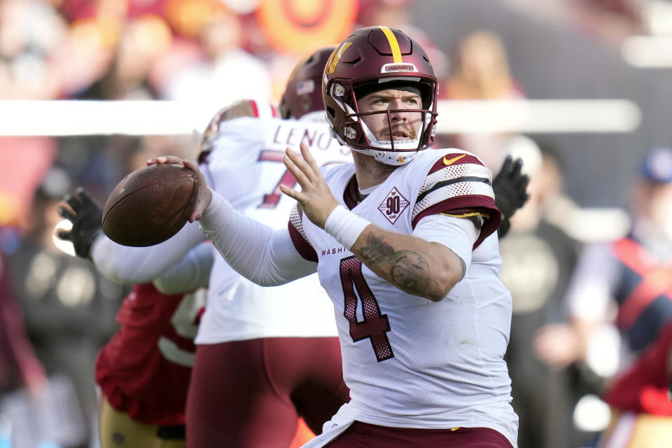 Washington Commanders quarterback Taylor Heinicke throws to a receiver in the first half of an NFL football game against the San Francisco 49ers, Saturday, Dec. 24, 2022, in Santa Clara, Calif. (AP Photo/Godofredo A. Vásquez)