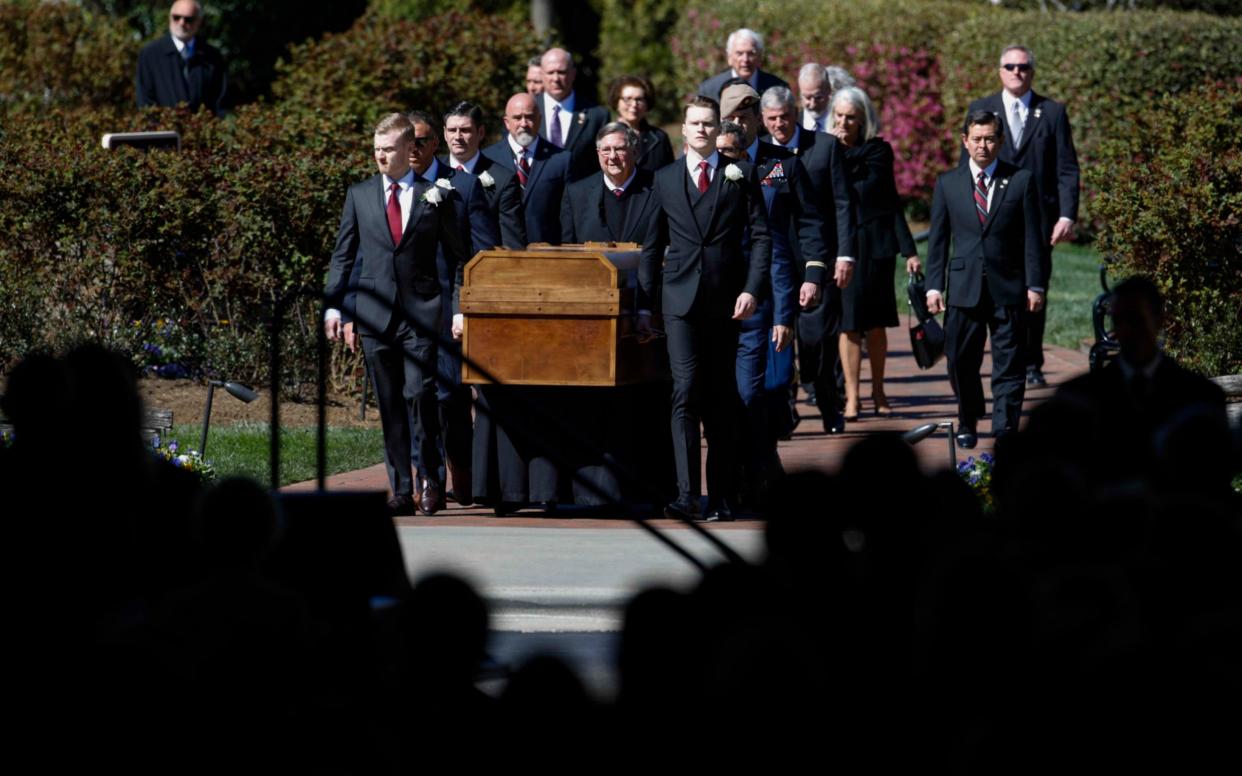 Billy Graham's casket arrives for his funeral service in Charlotte - REUTERS