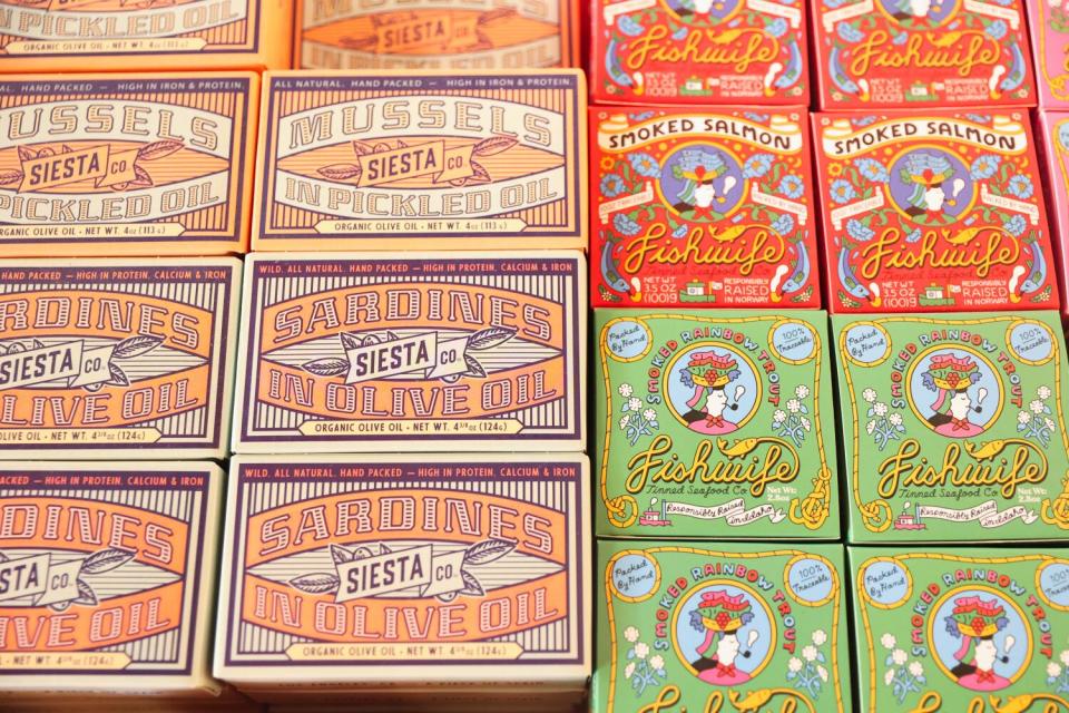 The colorful tinned fish boxes at Botanica restaurant's marketplace.