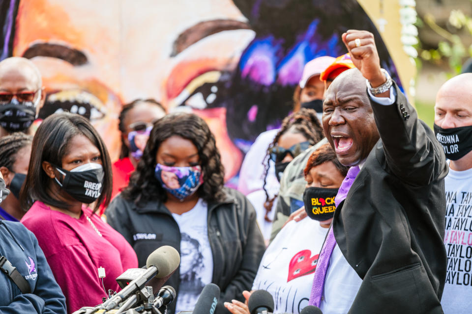 Attorney Ben Crump (R) leads a chant during a press conference on Sept 25, 2020 in Louisville, Kentucky.<span class="copyright">Jon Cherry—Getty Images</span>