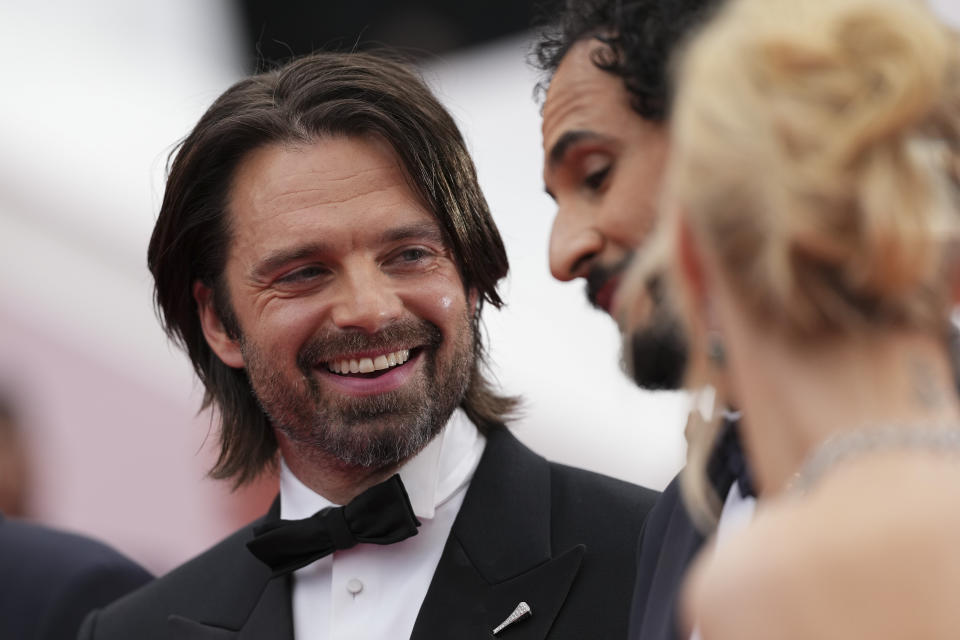 Sebastian Stan, from left, director Ali Abbasi, and Maria Bakalova pose for photographers upon arrival at the premiere of the film 'The Apprentice' at the 77th international film festival, Cannes, southern France, Monday, May 20, 2024. (Photo by Scott A Garfitt/Invision/AP)