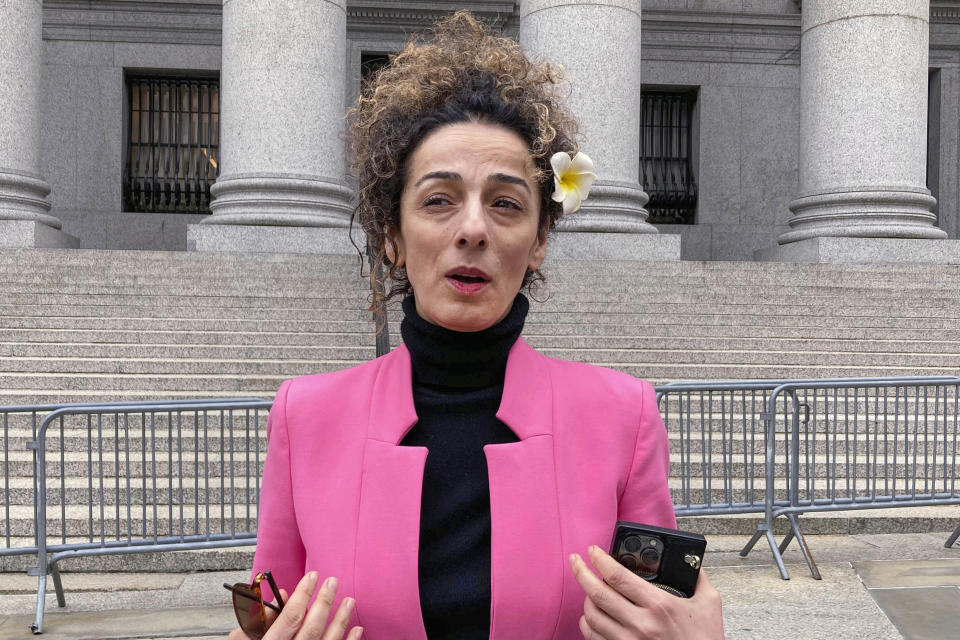 FILE - Masih Alinejad is interviewed outside Manhattan federal court, April 7, 2023, in New York. American officials say foreign countries like Iran and China intimidate, harass and sometimes plot violence against political opponents and activists in the U.S. “We’re not living in fear, we’re not living in paranoia, but the reality is very clear — that the Islamic Republic wants us dead, and we have to look over our shoulder every day,” the Iranian journalist said. (AP Photo/Lawrence Neumeister, File)