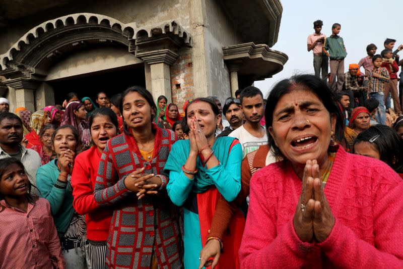 FILE PHOTO: Relatives of accused react as they demand a Central Bureau of Investigation probe into rape of a 23-year-old victim, who died in a New Delhi hospital on Friday, after she was set on fire by a gang of men, which included her alleged rapists