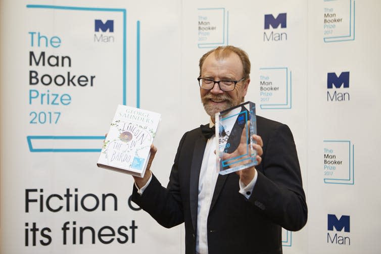 <span class="caption">George Saunders with his award.</span> <span class="attribution"><span class="source">Man Booker</span></span>