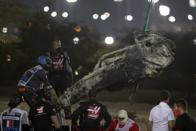 A part of Haas driver Romain Grosjean’s car is taken after the crash 