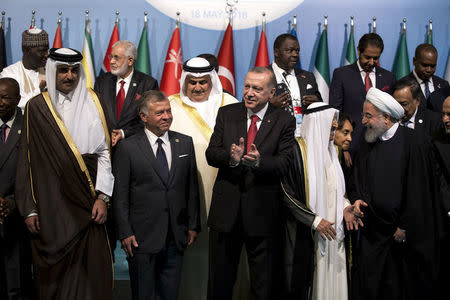 Turkish President Tayyip Erdogan poses with leaders and representatives of the Organisation of Islamic Cooperation (OIC) member states for a group photo during an extraordinary meeting in Istanbul, Turkey May 18, 2018. Arif Hudaverdi Yaman/Pool via Reuters