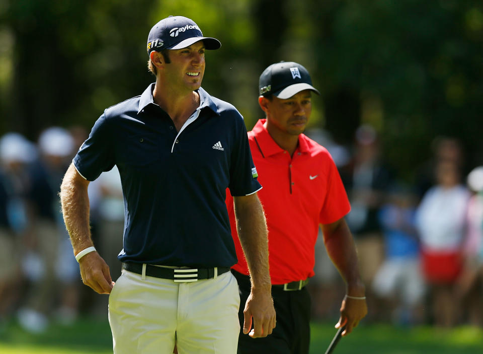 CARMEL, IN - SEPTEMBER 09: Dustin Johnson (L) and Tiger Woods wait on the first hole during the final round of the BMW Championship at Crooked Stick Golf Club on September 9, 2012 in Carmel, Indiana. (Photo by Scott Halleran/Getty Images)