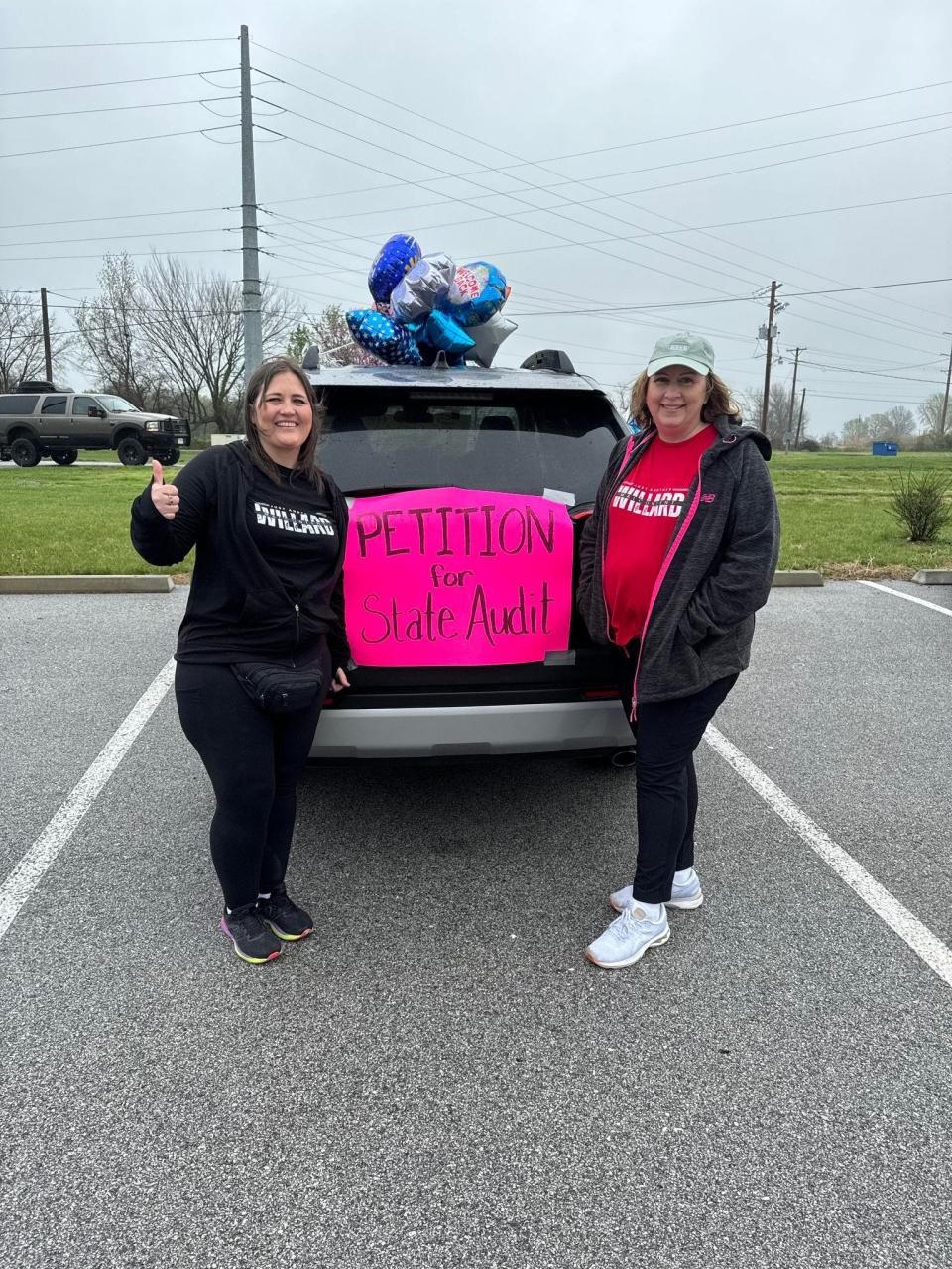 Megan Applegate and Angie Wilson of Willard collect signatures for the state to audit the city at polls during the April 2 election. Over 300 resident signatures are needed for the audit to be completed.