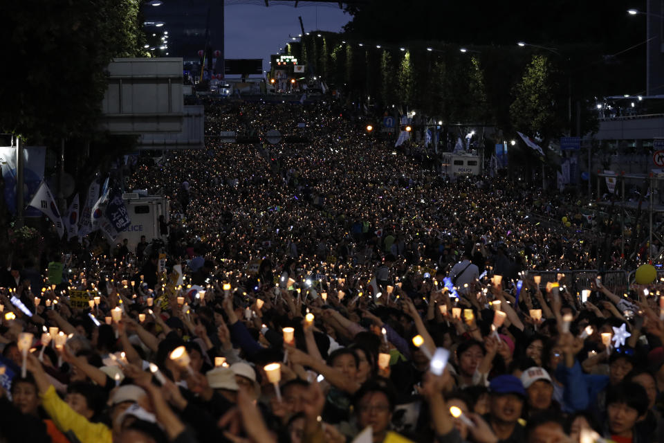 Supporters hold a candlelight rally for beleaguered South Korea's Justice Minister Cho Kuk in front of Seoul Central District Prosecutors' Office in Seoul, South Korea, Saturday, Oct. 5, 2019. (AP Photo/Lee Jin-man)