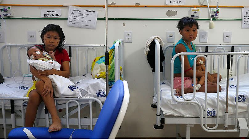 Yanomami women hold their babies receiving medical treatment at the Santo Antonio Children's Hospital, in Boa Vista, Roraima state, Brazil, 26 January 2023.