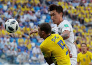 Soccer Football - World Cup - Group F - Sweden vs South Korea - Nizhny Novgorod Stadium, Nizhny Novgorod, Russia - June 18, 2018 South Korea's Jang Hyun-soo in action with Sweden's Marcus Berg REUTERS/Carlos Barria