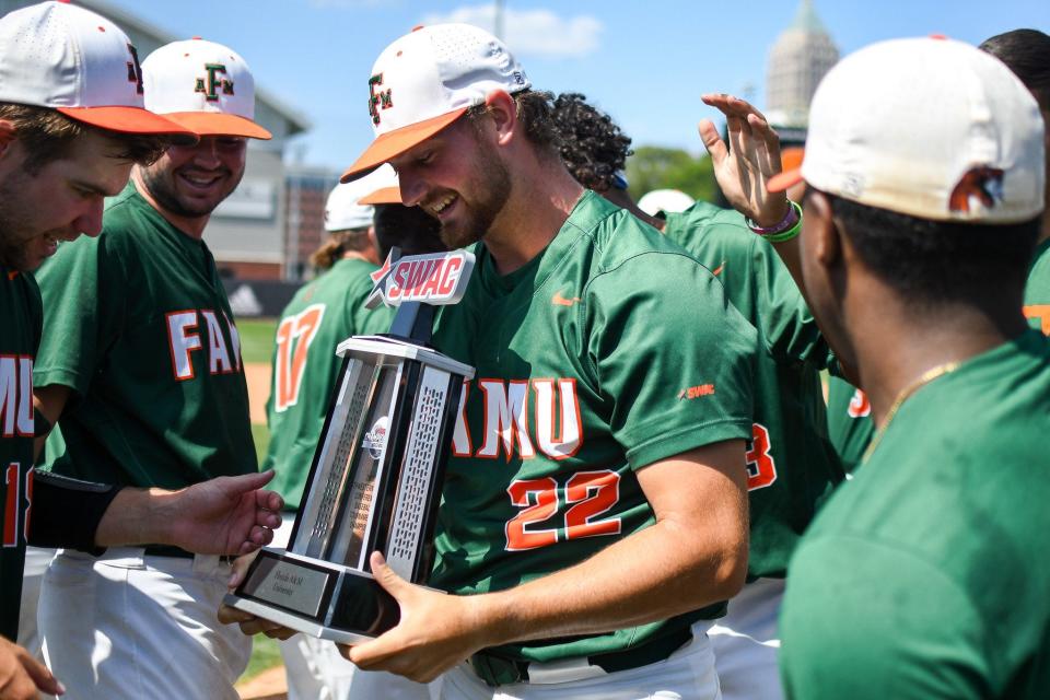 Florida A&M baseball pitcher Hunter Viets (22) holds the SWAC Championship trophy after defeating Bethune-Cookman at Georgia Tech's Russ Chandler Stadium in Atlanta, Georgia, Sunday, May 28, 2023