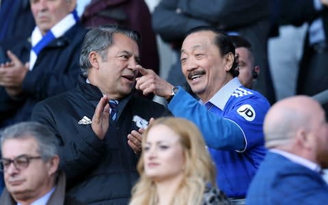 Cardiff City chairman Mehmet Dalman speaks with club owner Vincent Tan - Credit: Getty Images