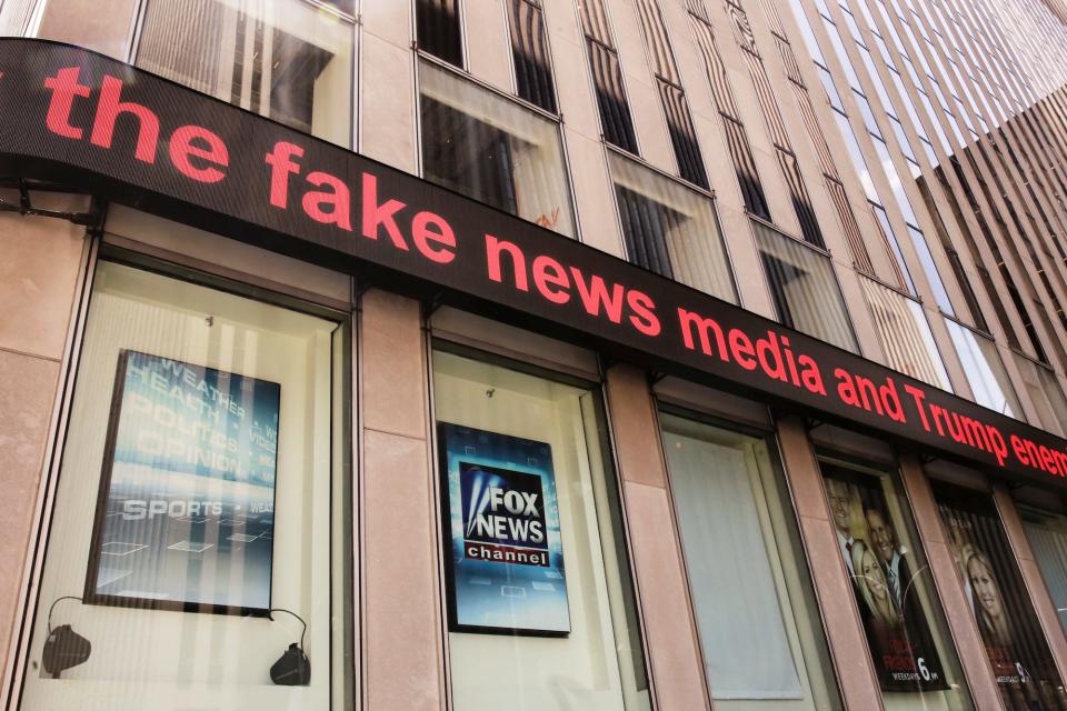 News headlines scroll above tthe Fox News studios in the News Corporation headquarters building, in New York, Tuesday, Aug. 1, 2017.