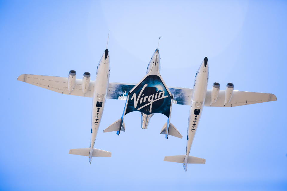 This Sept. 8, 2016 photo made available by Virgin Galactic shows the company's Spaceship Unity and Mothership Eve. After reaching nearly 50,000 feet (15,000 meters), Unity will be released and drop for a moment or two before its rocket motor ignites to send the craft on a steep climb toward space. (Virgin Galactic via AP)