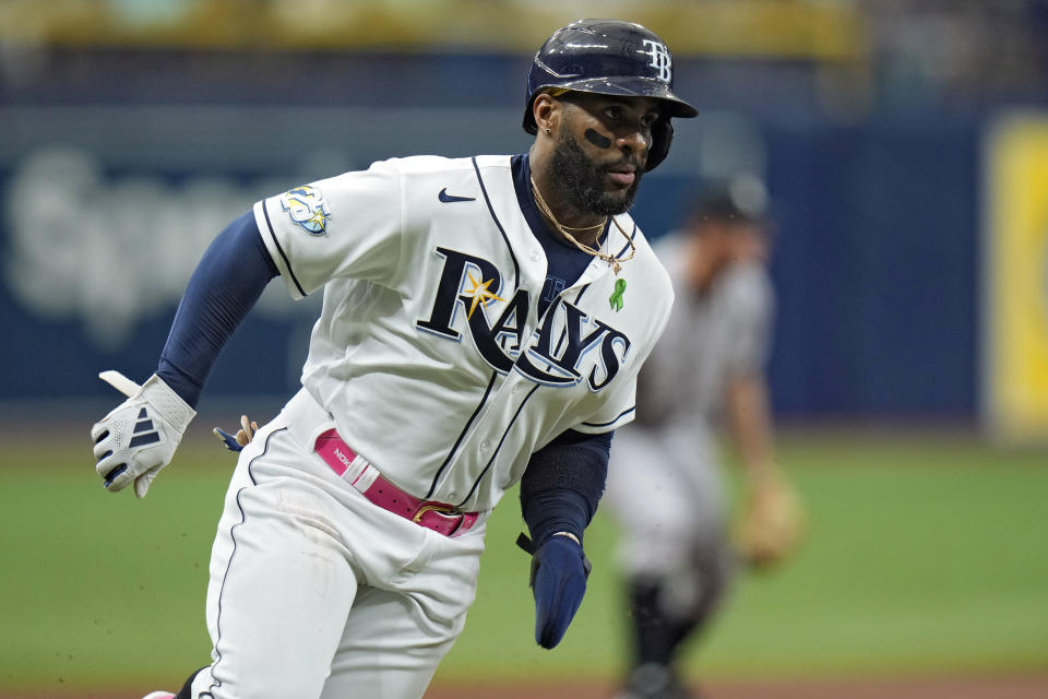 Tampa Bay Rays' Yandy Diaz scores on a two-run double by Manuel Margot off New York Yankees starting pitcher Domingo German during the first inning of a baseball game Saturday, May 6, 2023, in St. Petersburg, Fla. (AP Photo/Chris O'Meara)