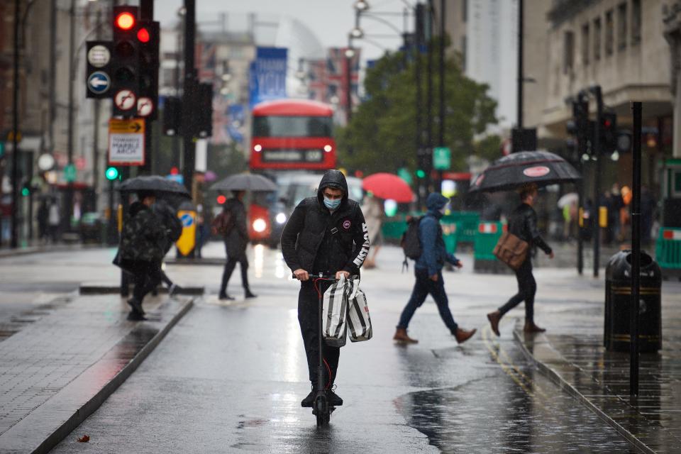A man rides an e-scooter on Oxford Street (Getty Images)
