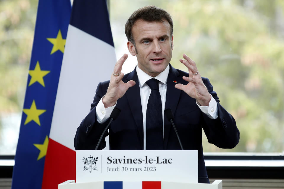French President Emmanuel Macron delivers a speech in Sainte-Savine-Le-Lac, southeastern France, Thursday, March 30, 2023. Emmanuel Macron presented a plan for saving France's water after exceptional winter drought, February wildfires and violence between protesters and police over an agricultural reservoir. (Sebastien Nogier, Pool via AP)