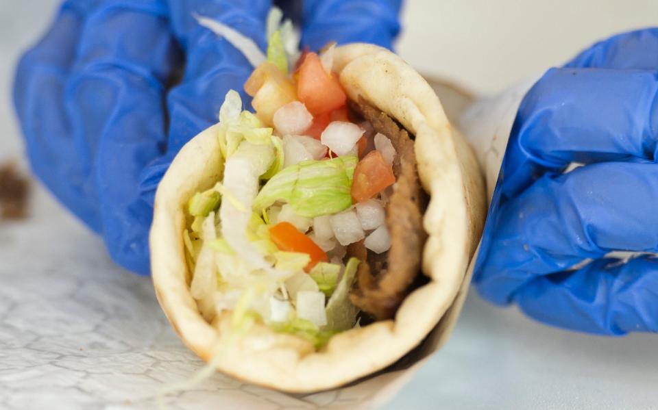 Sarah Johnson, of Anderson, wraps gyros during the Greenville Greek Festival at Saint George Greek Orthodox Cathedral Friday, May 17, 2019.
(Credit: SABRINA SCHAEFFER/GREENVILLE NEWS FILE)
