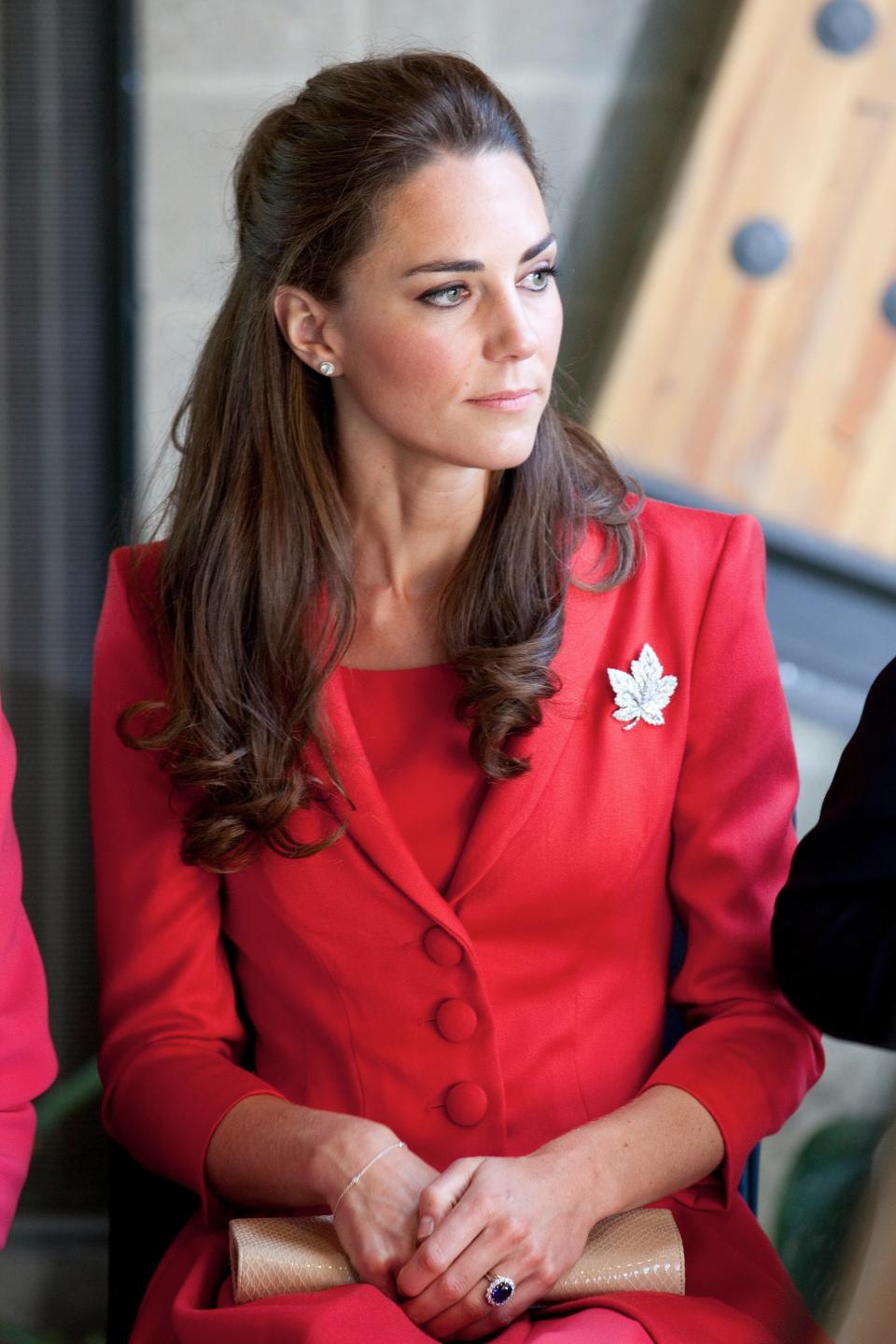 Kate appropriately donned a red Catherine Walker ensemble during a departure ceremony in Calgary, Alberta on July 8, 2011.