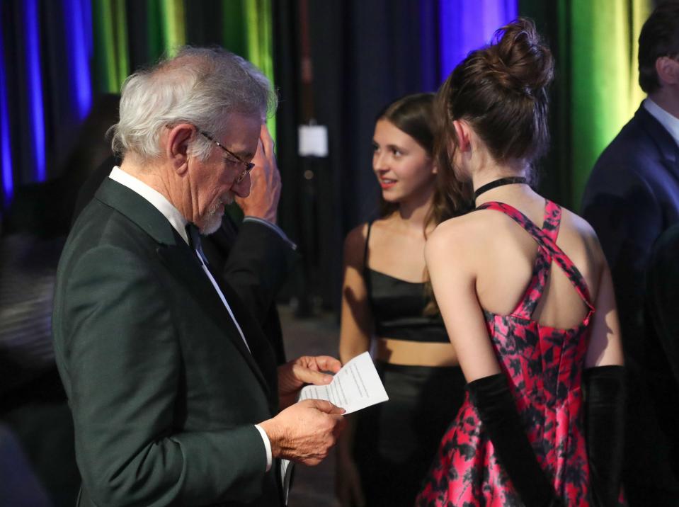 Steven Spielberg looks over his speech at the Palm Springs International Film Festival awards gala in Palm Springs, Calif., Jan. 5, 2023.