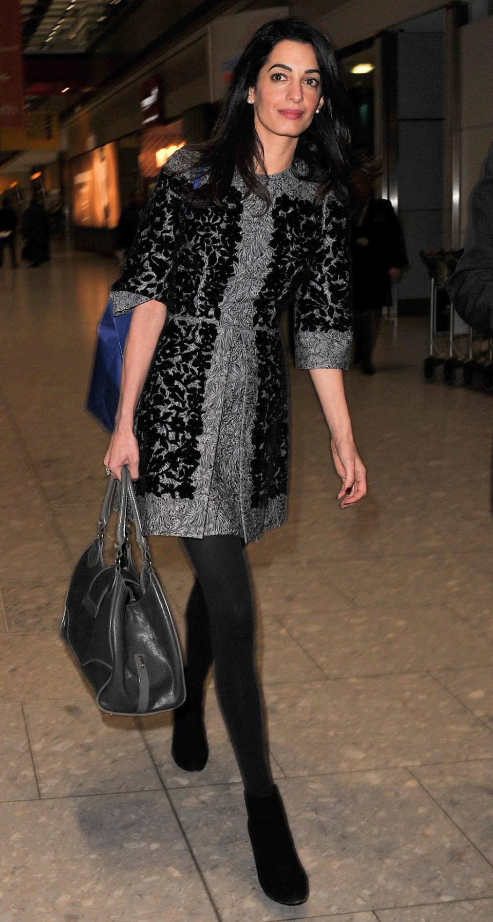 Amal Clooney spotted arriving at London’s Heathrow Airport in Dolce & Gabbana.