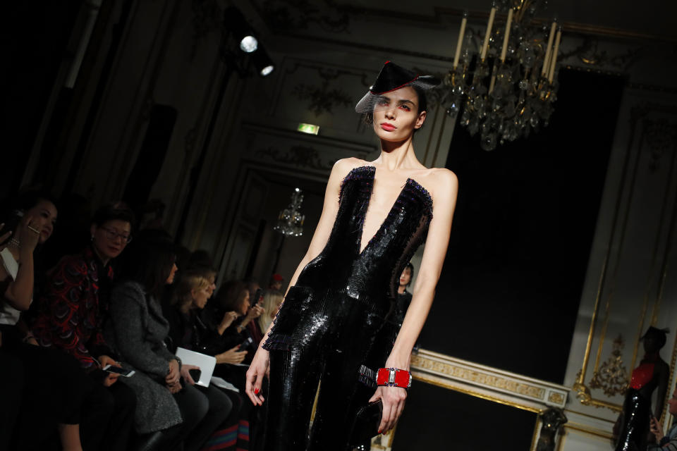 A model wears a creation for the Armani Spring/Summer 2019 Haute Couture fashion collection presented in Paris, Tuesday Jan. 22, 2019. (AP Photo/Francois Mori)