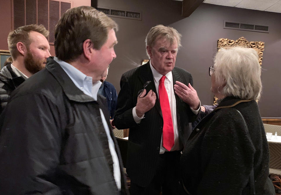 In this Sunday, Dec. 16, 2018, former "A Prairie Home Companion" host Garrison Keillor talks to fans after his performances at Crooners lounge in Fridley, Minn. Keillor is stepping back into the spotlight a year after Minnesota Public Radio cut ties with him over a sexual misconduct allegation. Keillor performed two sold-out shows Sunday night at Crooners, a jazz nightclub in a Minneapolis suburb near where he grew up. Fans laughed, applauded and sang along. (AP Photo/Jeff Baenen)