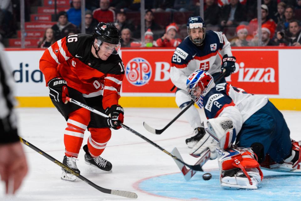 MONTREAL, QC - DECEMBER 26: Max Domi #16 of Team Canada is stopped by David Okolicany #2 of Team Slovakia during the 2015 IIHF World Junior Hockey Championship game at the Bell Centre on December 26, 2014 in Montreal, Quebec, Canada. Team Canada defeated Team Slovakia 8-0. (Photo by Minas Panagiotakis/Getty Images)