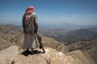 <p>On the road to Hajja, Yemen, May 7, 2017: An old farmer with his gun stands in the mountains of Yemen. (Photograph by Giles Clarke for UN OCHA/Getty Images) </p>