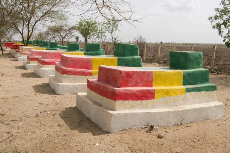 The graves of Ethiopian soldiers who died in the fighting with Eritrea are painted in the colors of the Ethiopian flag in the disputed border town of Badme