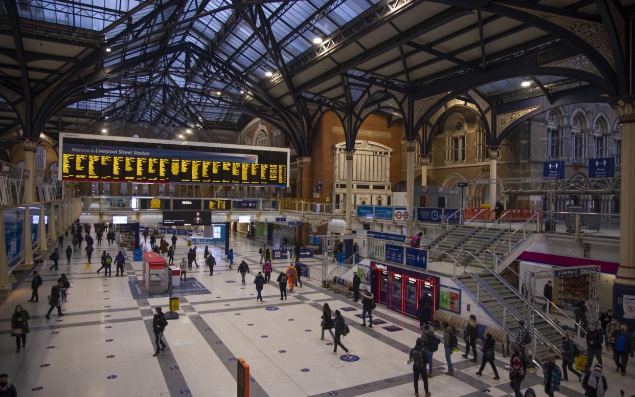 Commuters arrive at Liverpool Street railway station in the City of London, U.K., on Monday, Feb. 1, 2021. As London remodels its streets to accommodate more cyclists and pedestrians during the coronavirus pandemic, its facing a new kind of hurdle: legal challenges - Bloomberg