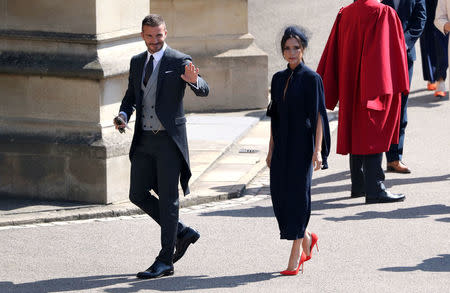 David and Victoria Beckham arrive for the wedding of Prince Harry and Meghan Markle at Windsor Castle. Saturday May 19, 2018. Andrew Matthews/Pool via REUTERS