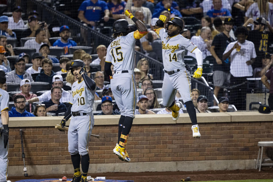 Pittsburgh Pirates' Oneil Cruz (15) celebrates with Rodolfo Castro after Cruz's two-run home run against the New York Mets during the eighth inning of a baseball game Friday, Sept. 16, 2022, in New York. (AP Photo/Corey Sipkin)