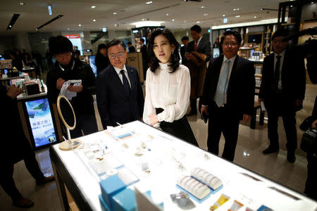 FILE PHOTO - Lee Boo-Jin (C), President and chief executive of Hotel Shilla, looks on after the opening ceremony of Shilla IPark Duty Free shop in Seoul, South Korea, March 25, 2016. REUTERS/Kim Hong-Ji/File Photo